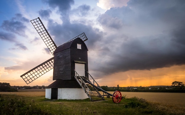 Wallpaper of the windmill mill in the farm at dusk