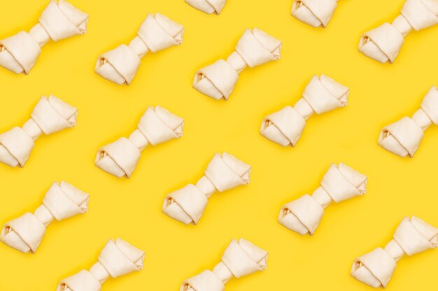 Wallpaper with rawhide bones on a yellow background