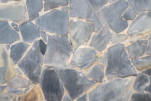 The walls are covered with stone cladding with a free pattern as a work of construction art