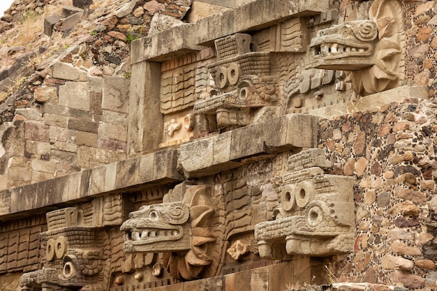 The walls of the pyramid are decorated with stone carvings. Teotihuacan, Mexico