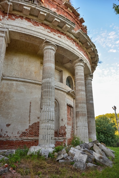 Walls and white columns of an abandoned Christian church in a Russian village