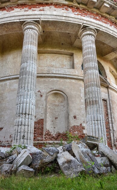 Walls and white columns of an abandoned Christian church in a Russian village