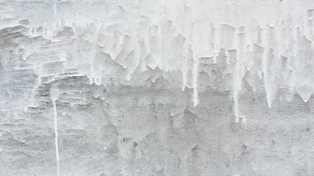 Walls with faded white paint and rough texture