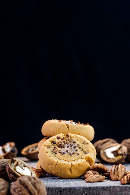 Walnut cookies on a black background