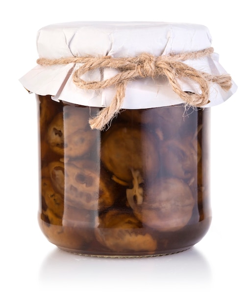 Walnut jam in a jar tied with a rope with clipping path