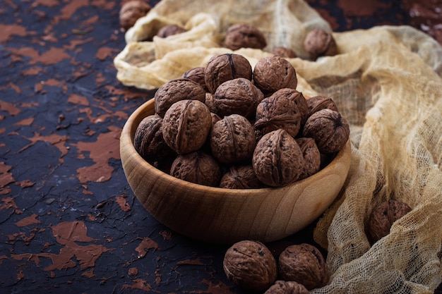 Walnuts on concrete background. Selective focus