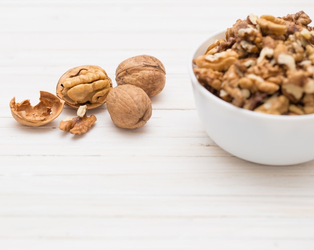 Walnuts on white wooden table