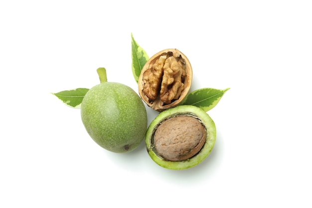 Walnuts with nut peel isolated on white background