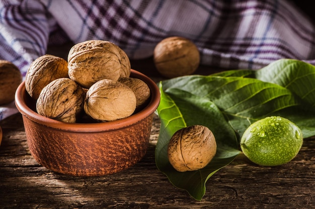 Walnuts with and without shells filling in the picture Background of fresh walnuts