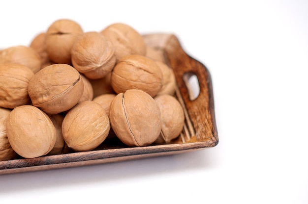 walnuts in a wooden bowl.