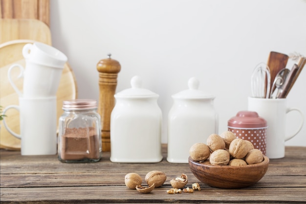 Walnuts in wooden plate in the kitchen