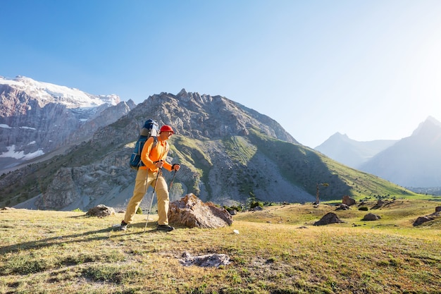 Wanderlust time. Man hiking in beautiful Fann mountains in Pamir, Tajikistan. Central Asia.