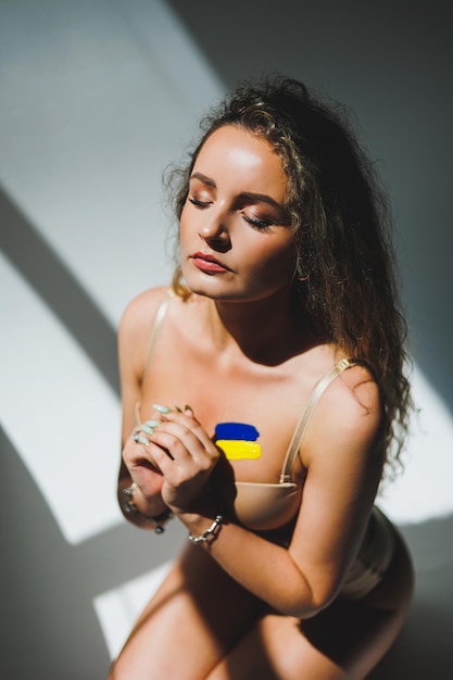 War in Ukraine prehistory of the Ukrainian conflict The Ukrainian flag draws on the woman's body Peace activism no war and support concept