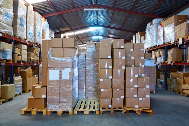 Warehouse stograge with stacked boxes in rows