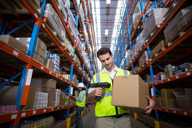 Warehouse worker using scanner