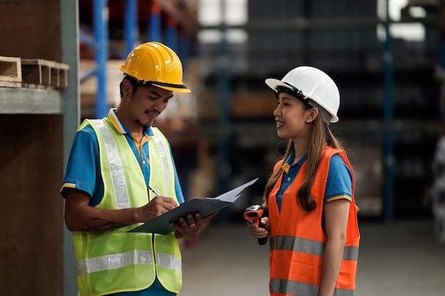 Warehouse workers selling stock checks with tablets and bar code launcherbusiness idea