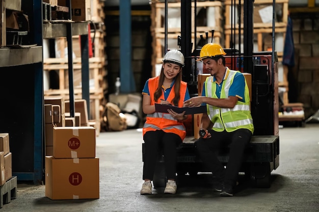 Warehouse workers selling stock checks with tablets and bar code launcherbusiness idea