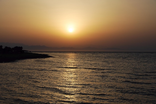 Warm bright sunrise on the sea on vacation