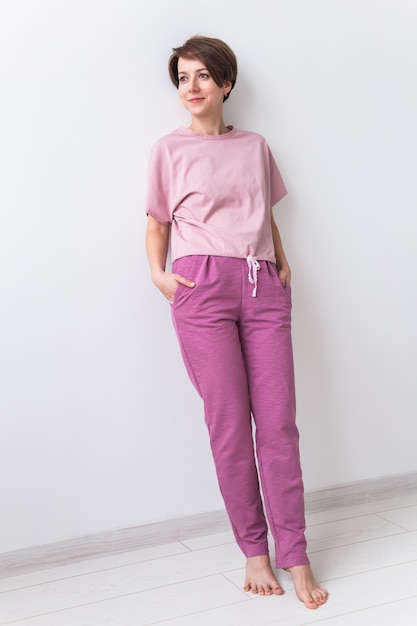 Warm pink kit for sleeping. Soft cotton t-shirt and pants. Comfortable clothes for healthy sleep. Pajamas concept.