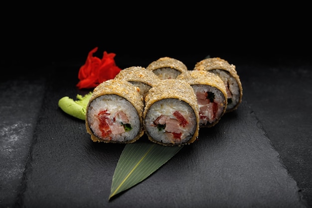 Warm sushi rolls with tuna and salmon