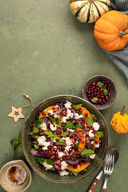 Warm winter quinoa salad with pumpkin chorizo and mozzarella arugula leaves and pomegranate