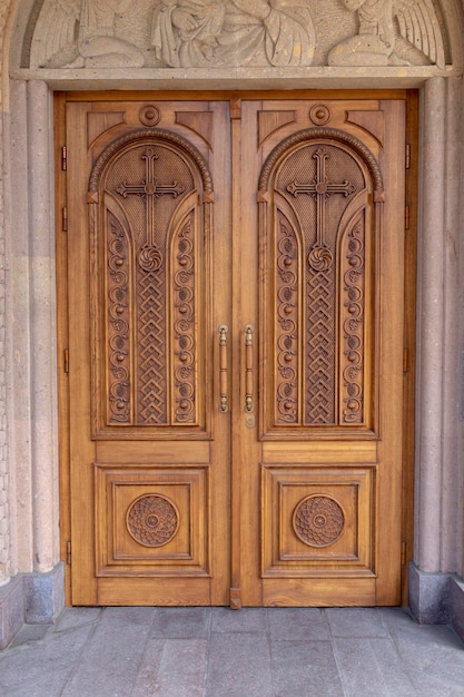 Warm wooden door with crosses