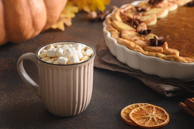 Warming coffee and homemade pumpkin pie for autumn cozy day