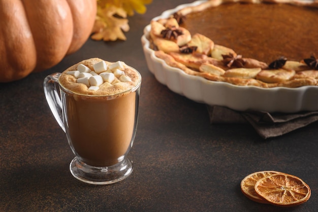 Warming coffee and homemade pumpkin pie for autumn cozy day