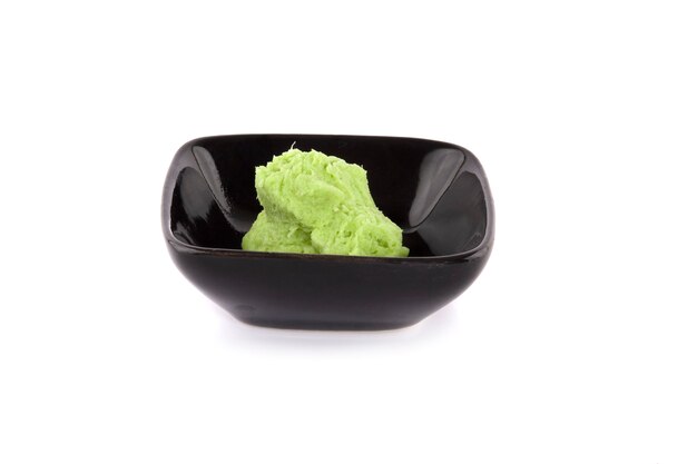 Wasabi in bowl isolated on a white surface