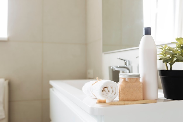 Washbasin in white bathroom with bath accessories. Hotel cleaning concept. Household concept.