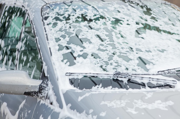 Washing the car with foam in a selfservice sink