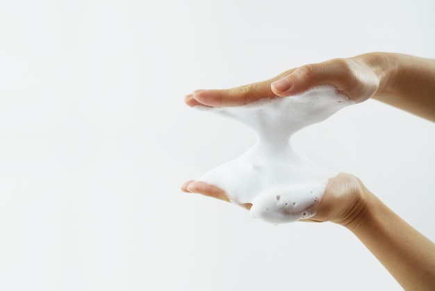 Washing of hands with soap foam. 