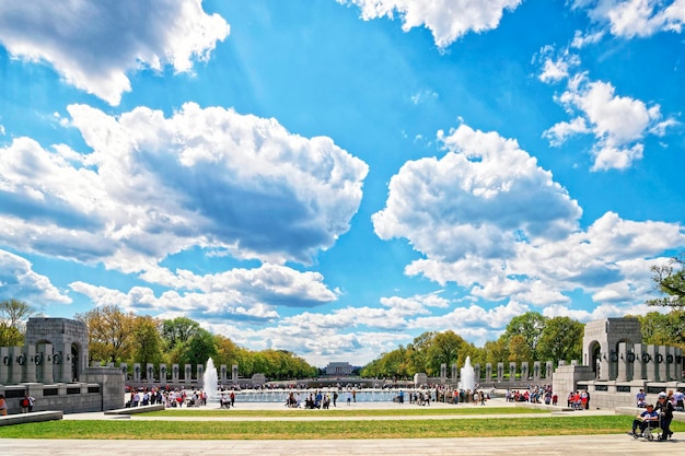 Washington DC, USA - May 2, 2015: War Veterans and guardians of Honor Flight nonprofit organization in National World War 2 Memorial, National Mall. Lincoln memorial in the middle on background.