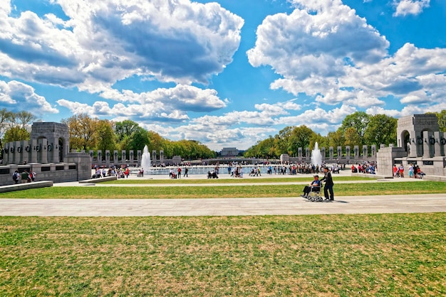 Washington DC, USA - May 2, 2015: War Veterans and guardians of Honor Flight nonprofit organization on National World War 2 Memorial, National Mall. Lincoln memorial in the middle on the background.