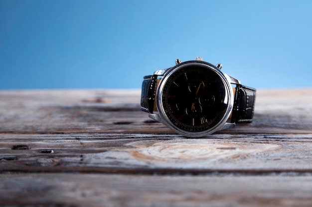 watch on a dark wooden table