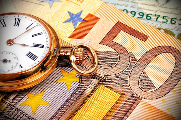 Watch and euro bills