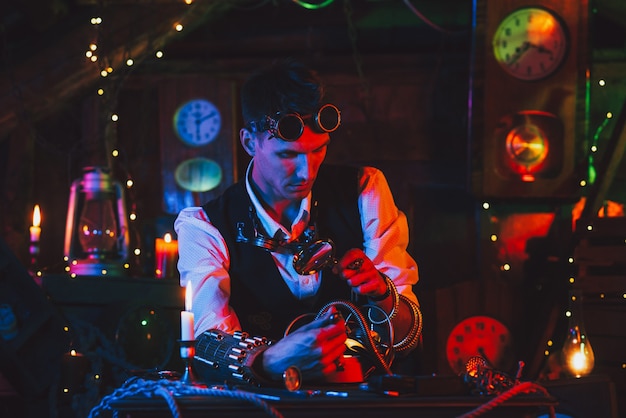 Watchmaker with a magnifying glass repairs a watch from a watch workshop