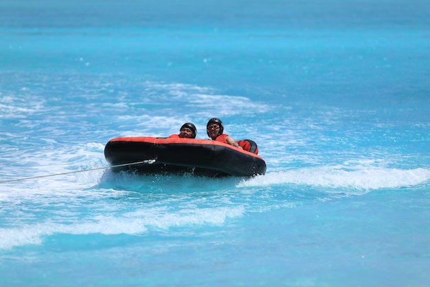 water attraction, riding on an inflatable sofa