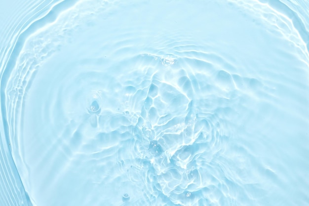 Water blue surface abstract background Waves and ripples of cosmetic moisturizer with bubbles