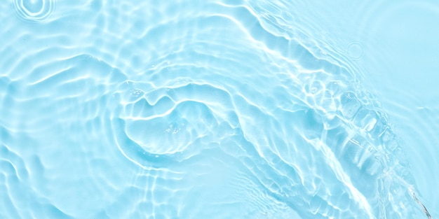 Water blue surface abstract background Waves and ripples of cosmetic moisturizer with bubbles