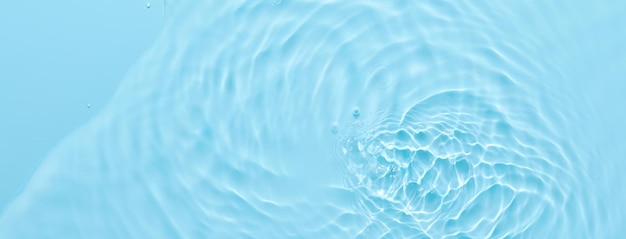 Water blue surface abstract background Waves and ripples of cosmetic moisturizer with bubbles