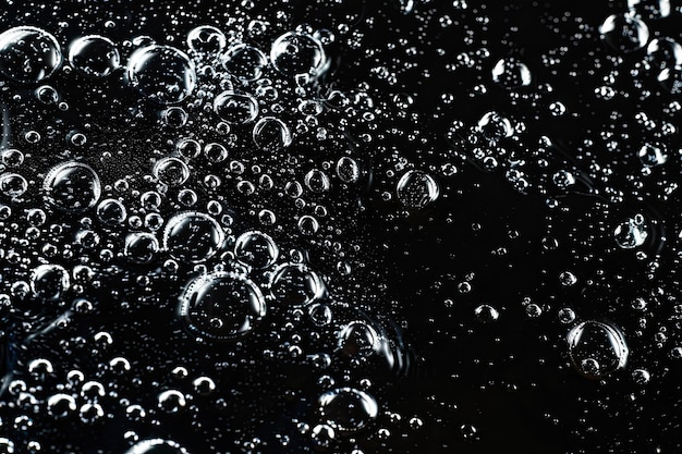 Photo water bubbles on black background