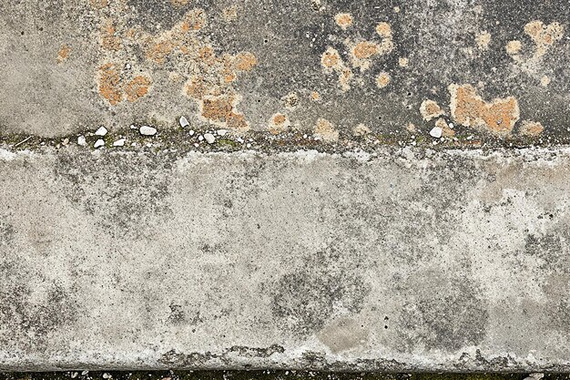 Photo water on a concrete wall with a lot of foam on it