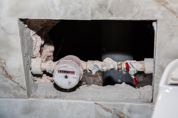 Water counter in the dust Maintenance repair works Restoration indoors