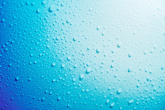 Water droplets on blue background