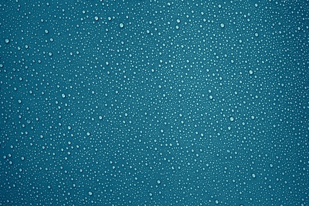 Water droplets on the dark blue color background for cool and fresh texture and Abstract background.