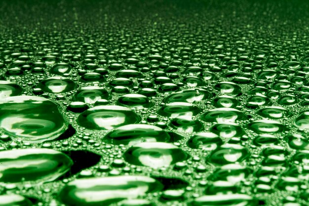 Water droplets on green metal a beautiful unusual texture