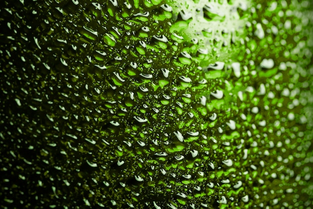 Water droplets on green metal a beautiful unusual texture