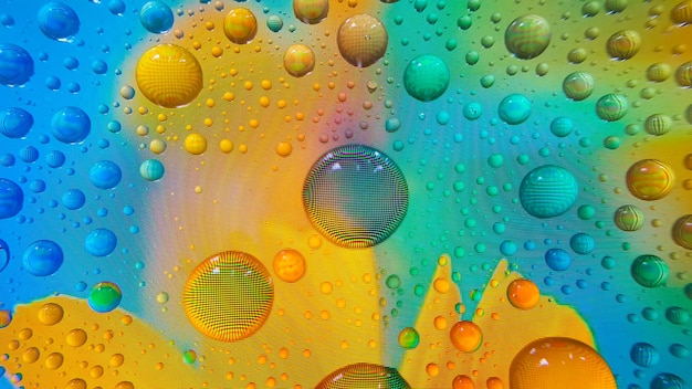 Water droplets on the phone screen with a colourful background