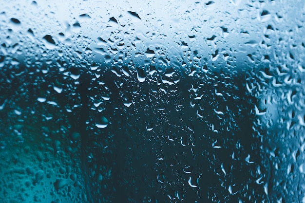 Water droplets on the windows of a large house. On a day of heavy rain, a storm